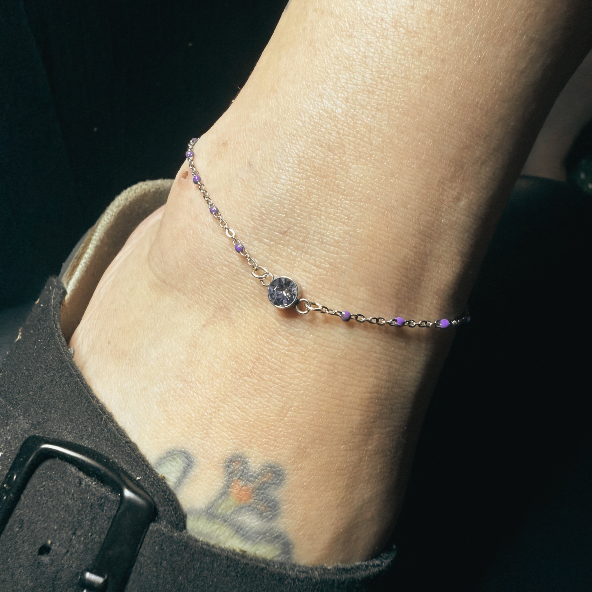 Permanent anklet with purple accents